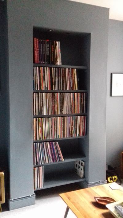 Painted alcove shelves filled with vinyl records