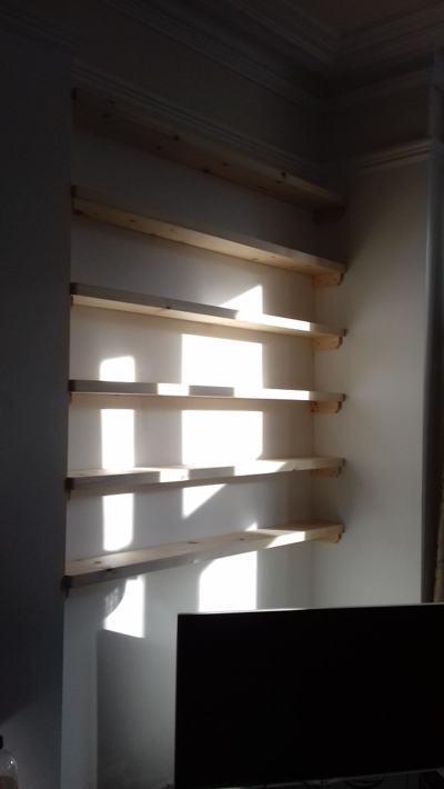 Alcove shelves in living room with sunlight