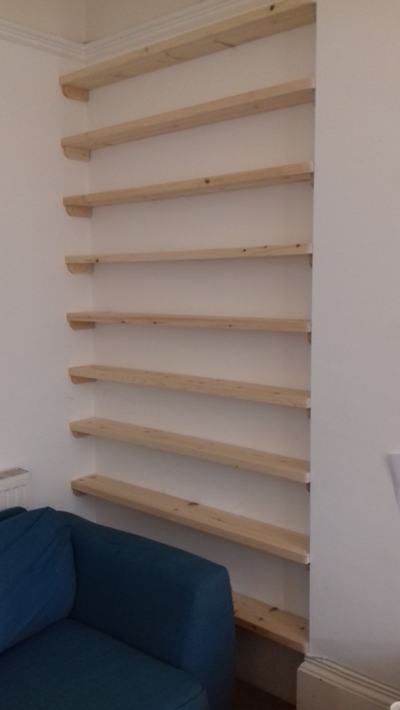 Alcove shelves both sides of Victorian fireplace