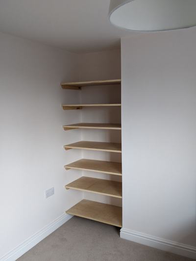 Plywood alcove shelves in bedroom
