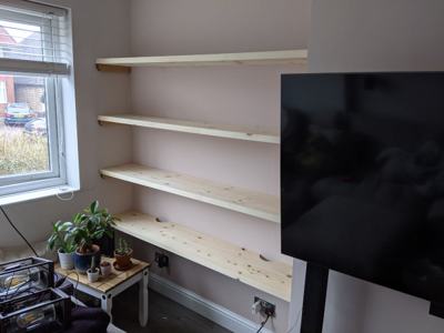 Alcove shelves in living room beside TV