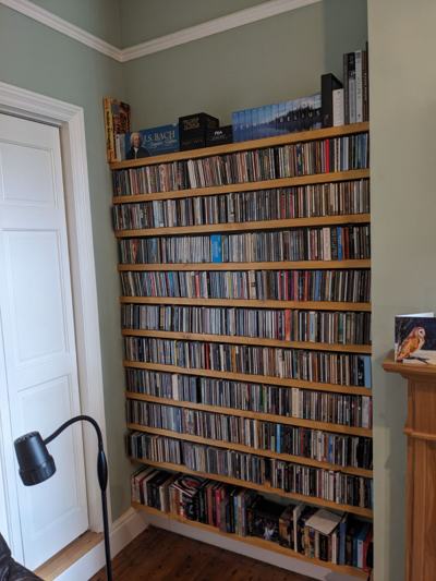 CD shelves fitted floor to ceiling in alcove