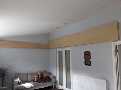 Boxing in beam along ceiling in living room
