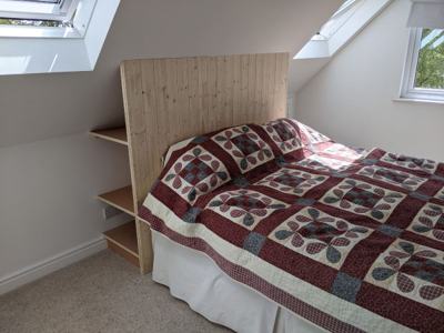 Bedhead with built-in shelving