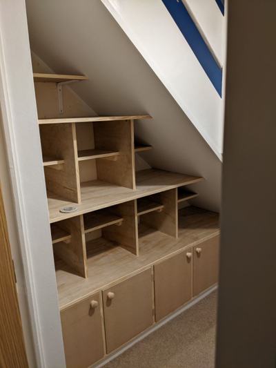 Under-stair shelving and cupboards