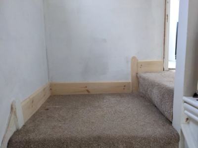 Skirting board fitted at base of stairs