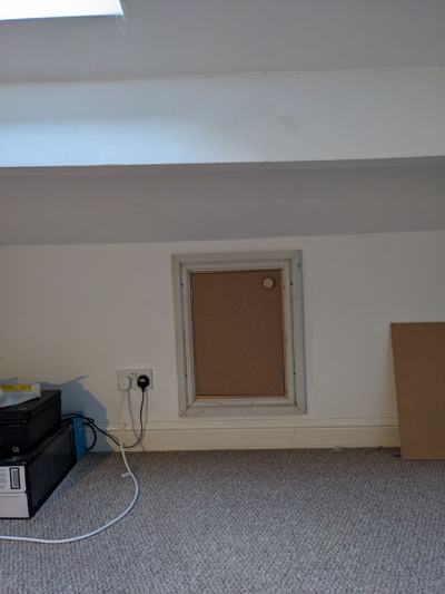 Access panel in loft wall