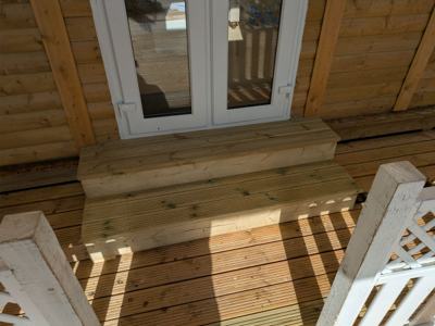 Decking step built at cabin doorway