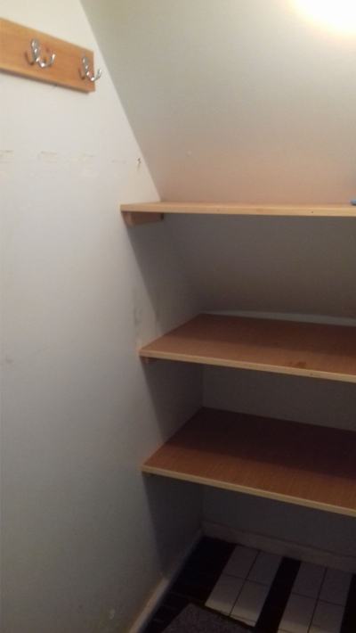 Shelves fitted in cupboard under stairs