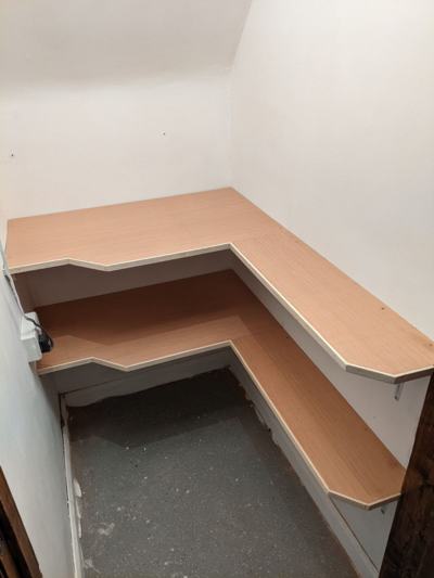 L-shaped shelving and hooks in cupboard