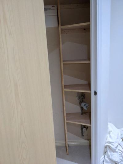 L-shaped shelving in cupboard space